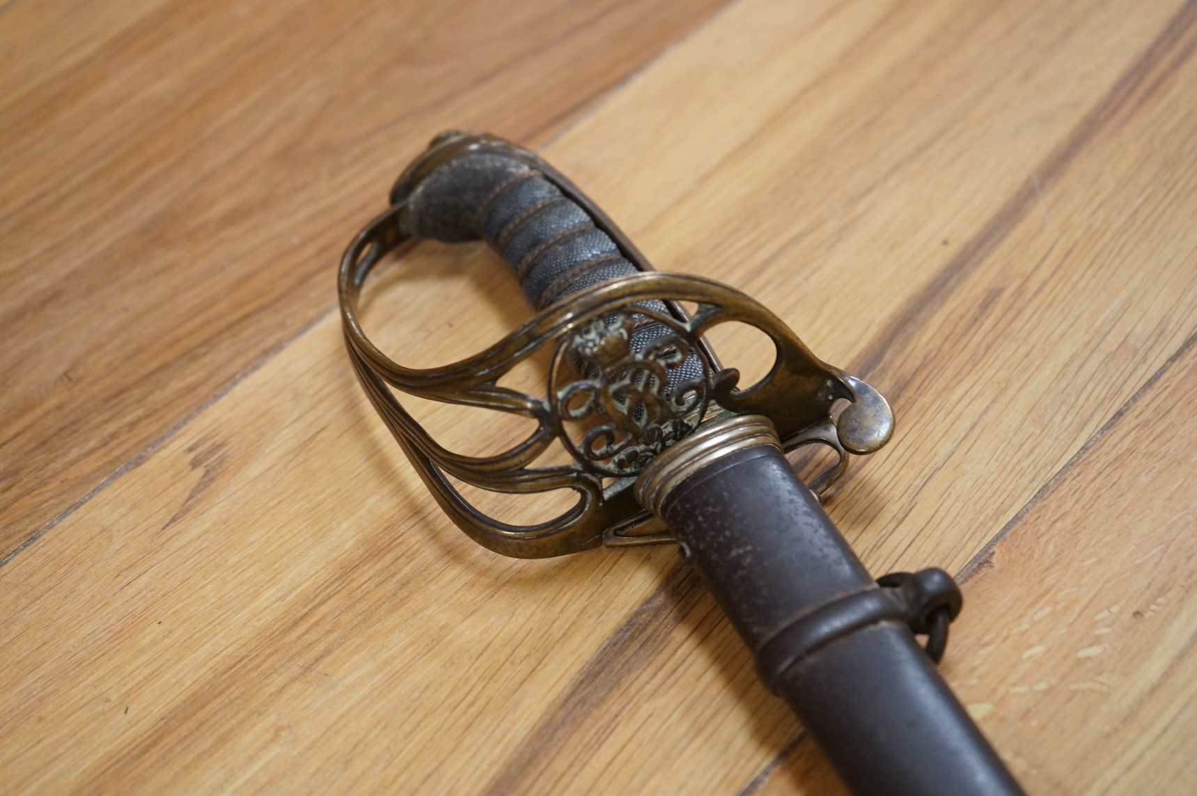 A Victorian 1845 pattern infantry officer’s levee sword, with slender blade etched; Hamburger Rogers & Co., and crowned VR and foliage, regulation pierced brass guard with folding side guard, wire bound fish skin covered